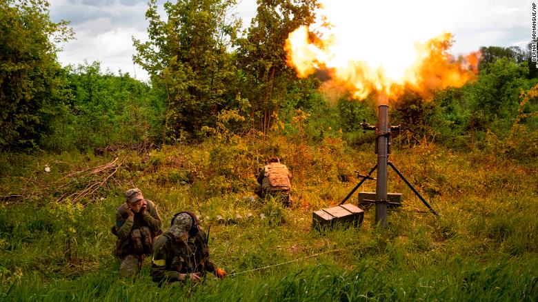 Ukrainian servicemen fire mortars towards Russian positions in east Kharkiv region, Ukraine, Tuesday, May 17, 2022. (AP Photo/Bernat Armangue)