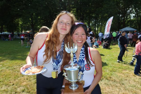 Avery Lenderman (Left) and Maddie Tsai (Right) hold the Junior girls trophy after placing first at Northwest Regionals.