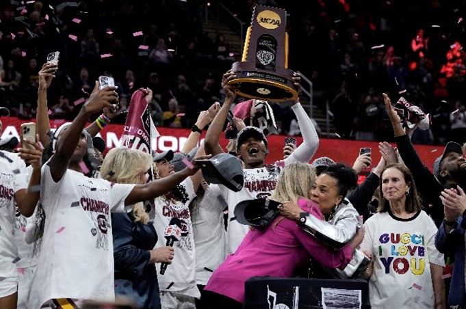 South Carolina's players and coach celebrate after the college basketball championship game, 2024. Morry Gash, AP