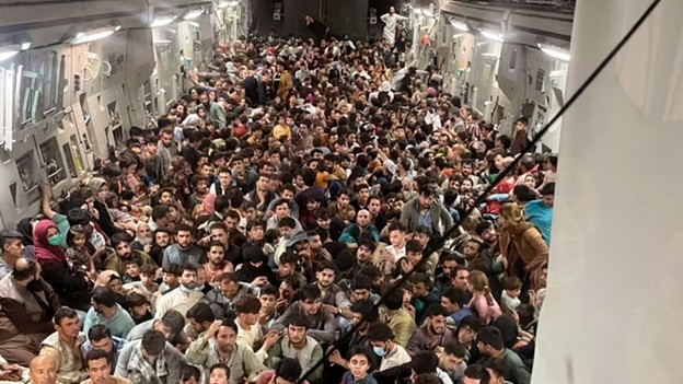 Afghans packed inside an aircraft (CNN)